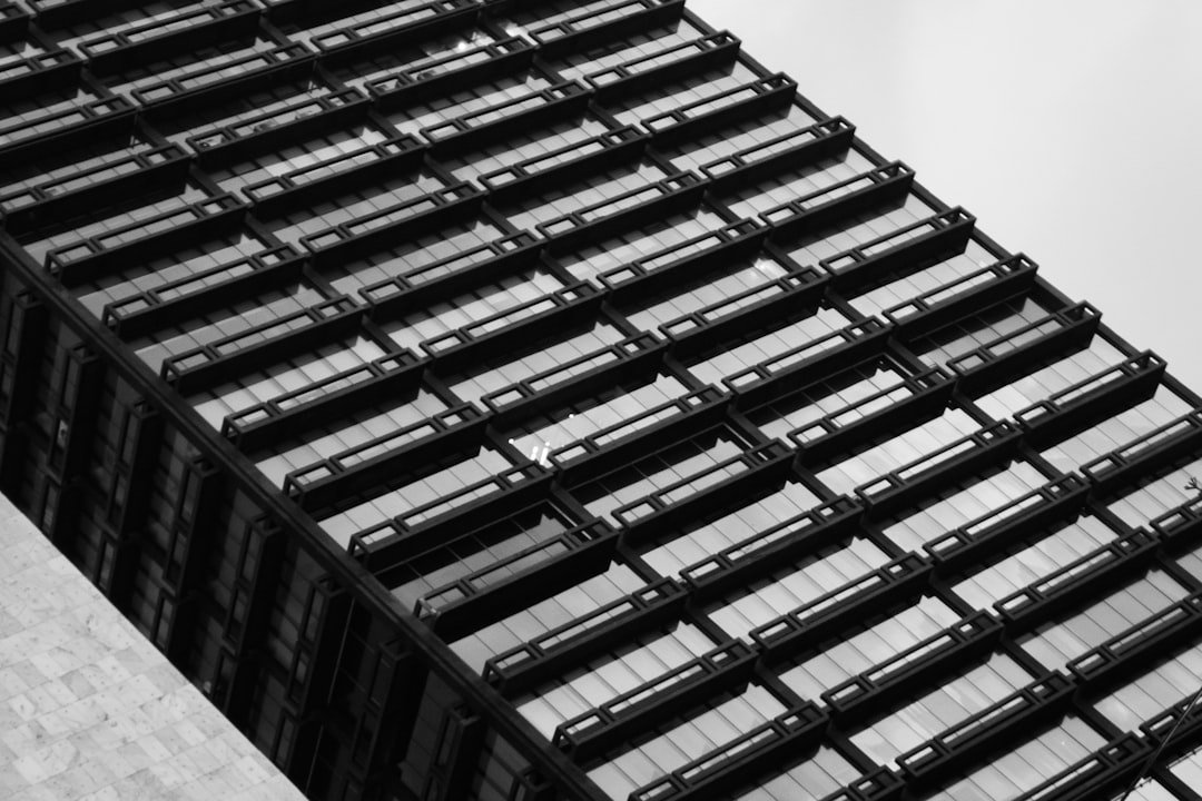 The black and white photo shows a high-rise building.