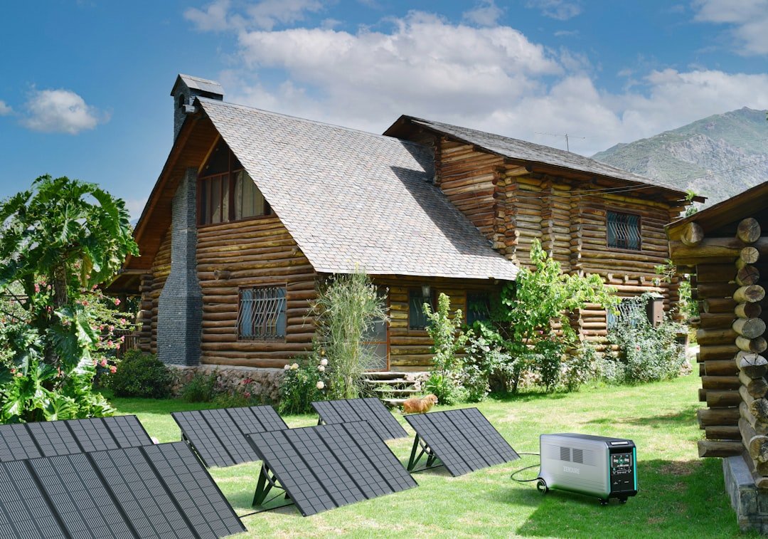 A log cabin with solar panels on the lawn