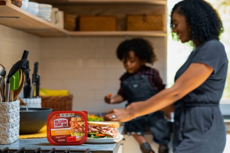 Man in black polo shirt standing beside man in black shirt
