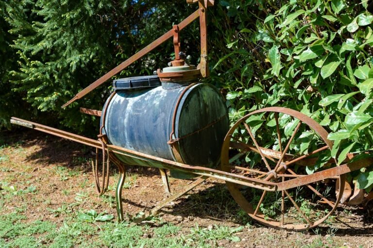 Rusty antique farm equipment with a water tank