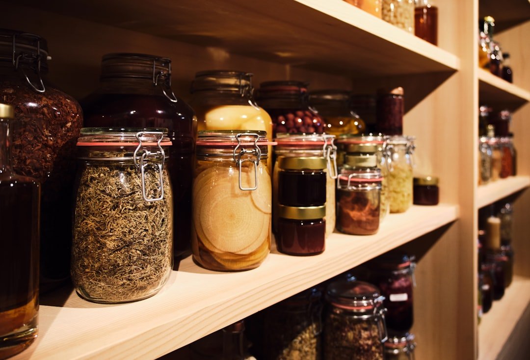 A shelf filled with lots of different types of jars