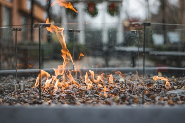 Flames burning in a modern outdoor fire pit.