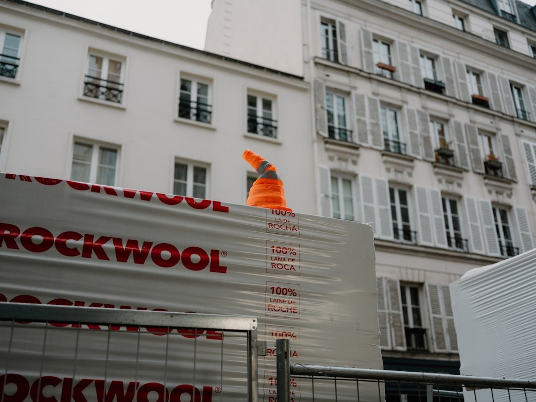 Orange traffic cone on construction materials