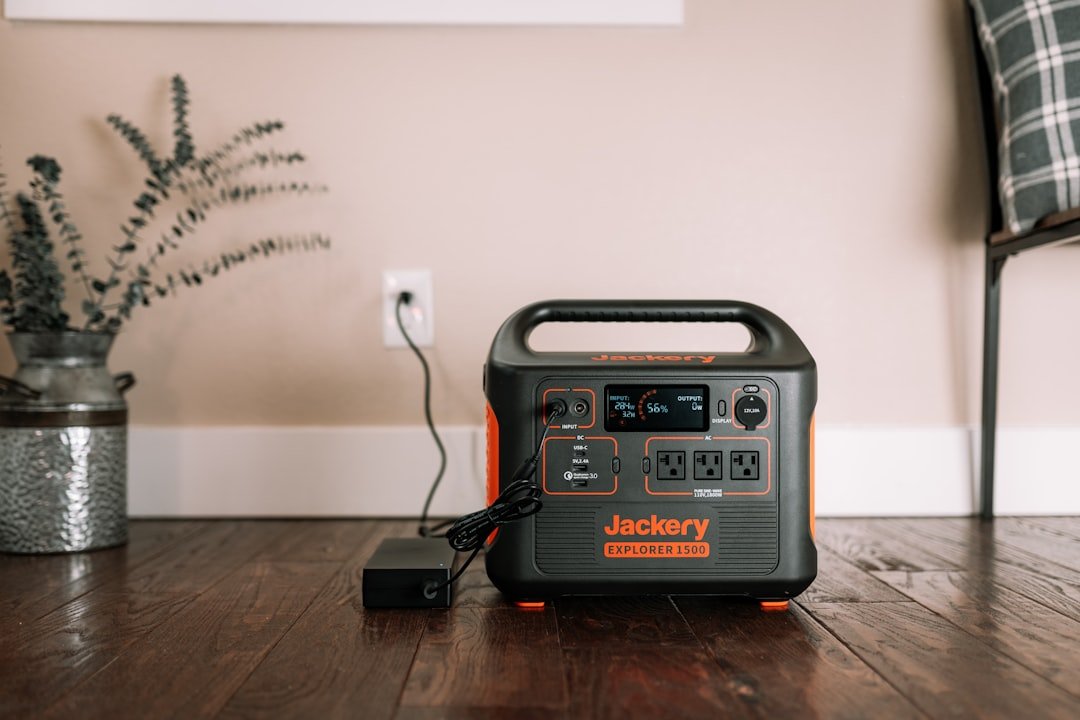 A black and silver radio on a wooden table