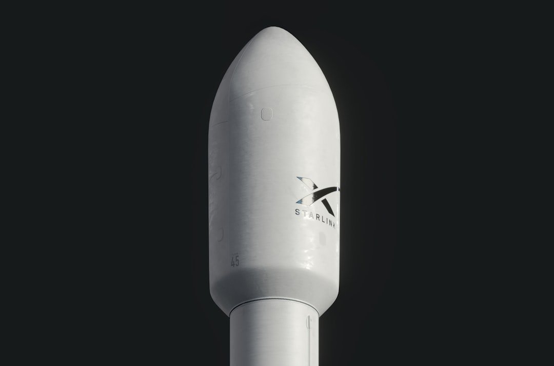 A close up of a white rocket on a black background