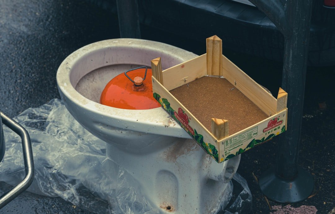 White and brown wooden box on white round container