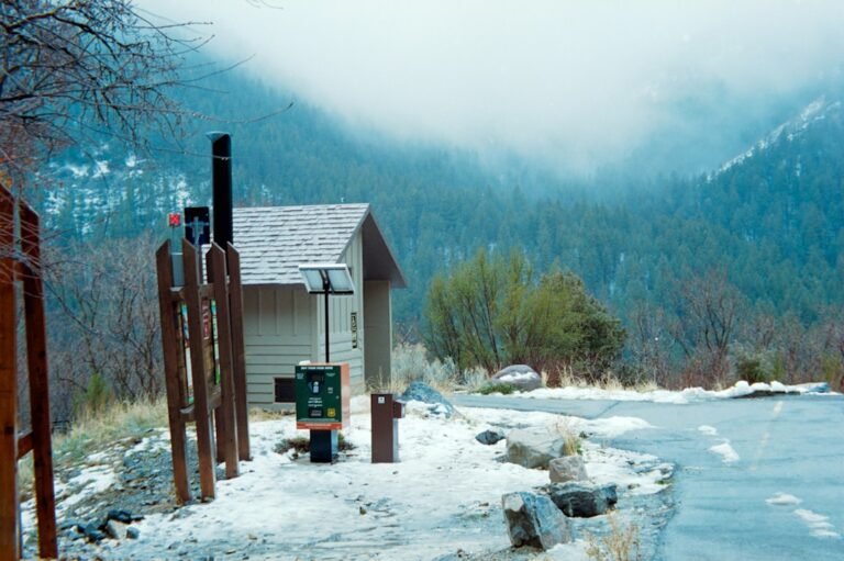 Small building with weather station in snowy forest