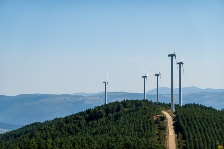 A group of wind turbines on a hill